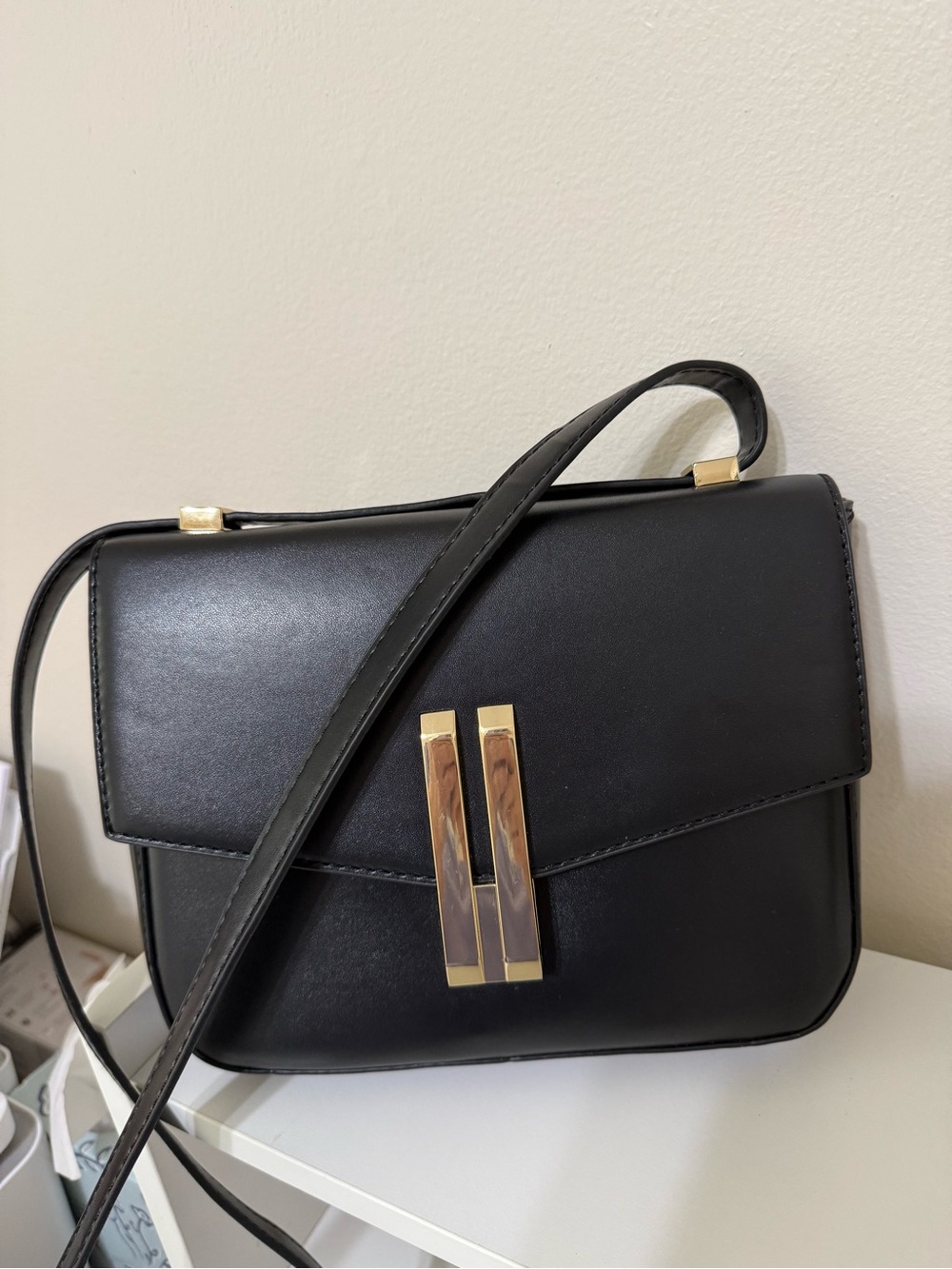 Classic Black Crossbody Handbag with Gold Accent